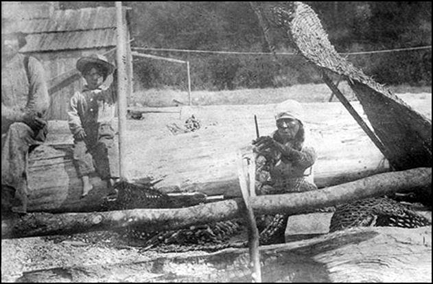 Indian woman drying clams